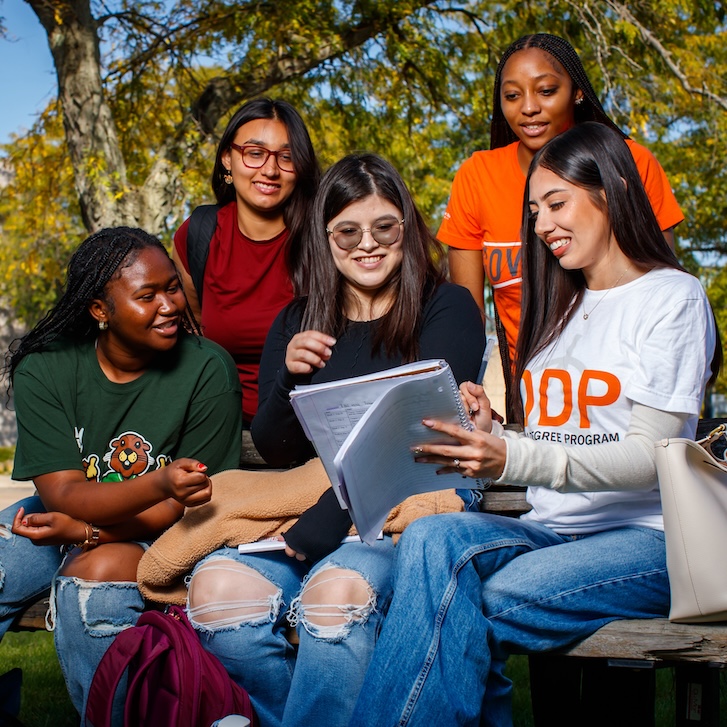 A group of people sitting outside